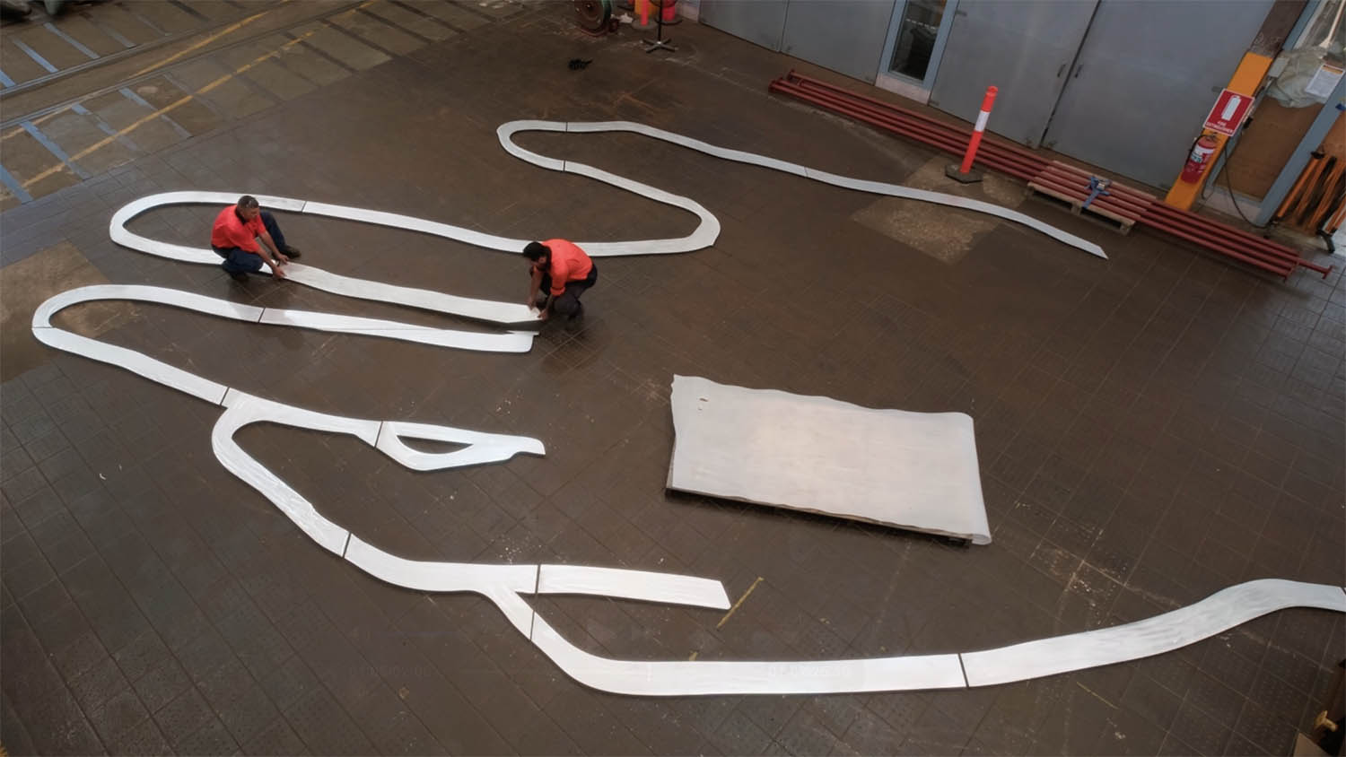 Behind the scenes, Abdul Abdullah's artwork being reproduced at scale. Arden Station